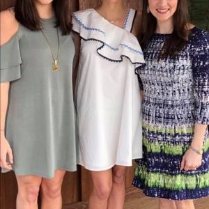 White dress with one shoulder ruffle. Size small